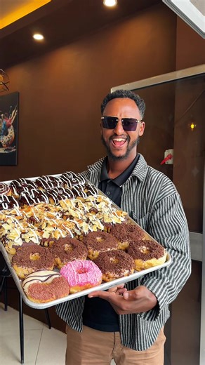 Addis donut lovers, this one’s for you 🤯🍩 Today we went to Donut Galaxy and tested their Netherlands & Canada–style donuts — and honestly, the flavors are next level. Soft, fresh, and loaded with toppings… definitely one of the best donut spots we’ve tried 😍🔥 @donut.galaxyet 🍩 Donuts we tried: • White Chocolate – 100 birr • Cinnamon Bomb – 120 birr • Choco Peanut – 100 birr • Caramel Donut – 100 birr • Oreo Cookie Donut – 100 birr • Chocolate Donut – 120 birr • Vanilla Petal – 100 birr • Wh
