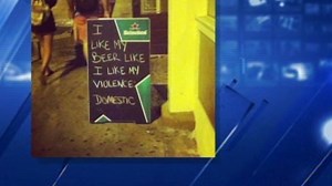 Bar sign mocks domestic violence