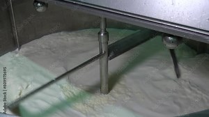 Mixing Raw Milk During Pasteurization Process - Zoom Out Shot. Pasteurization is a Process of Food Preservation in Which Milk is Treated with Mild Heat to Eliminate Pathogens. Dairy Plant Food Safety.