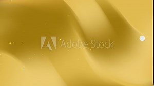 Abstract gold gradient background with smooth motion and shimmering particles.