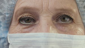 Eyes of a doctor or nurse with a mask - Free Stock Video