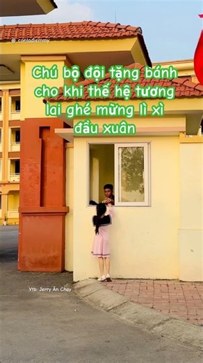 The soldier gives cakes to the younger generation when they visit to receive lucky money at the b...