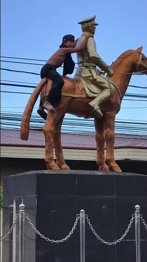 Boy quickly climbs down statue after joking mention of mayor in Lucena City, Philippines