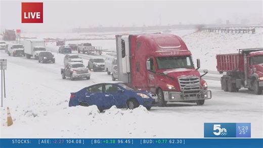 Ice under St. Louis snow slows drivers way down
