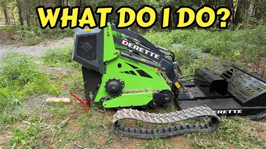 Watch how to put a track back on a mini skid steer easily