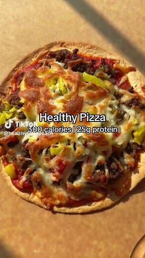Healthy Pizza: If your craving pizza but want to keep it on the healthy side, you gotta make these. We have pizza night once a week..heck, sometime twice a week and these hit the spot! 300 calories | 25 grams protein 1 Mission Low Carb Tortilla 3 tbsp Rao’s pizza sauce 1/3-1/2 cup lean ground beef 1/4 cup part-skim mozzarella cheese 1 tbsp chopped tomatoes 1 tbsp chopped onions 1/2 tbsp chopped jalapeños 1 tbsp chopped banana peppers 1. Assemble the pizza. Cook in a 425F oven for 8-10 minutes or