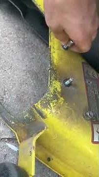 Putting the side discharge chute back on the John Deere E130