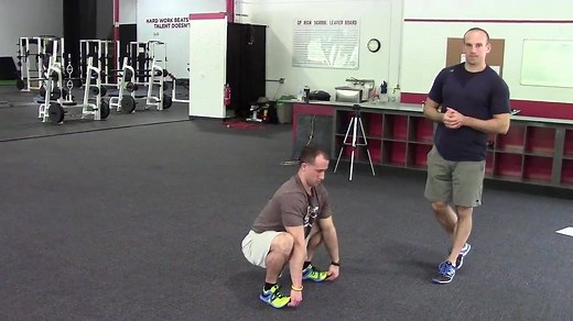 The squat-to-stand with diagonal reach is a great test of not just range of motion, but also stability within that range of motion. If you can do this mobility drill with good technique, chances are that you move pretty darn well. This video comes from The High Performance Handbook" video database. Learn more at http://www.HighPerformanceHandbook.com. | Eric Cressey