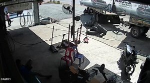 Over-inflated tyre explodes and knocks over mechanic