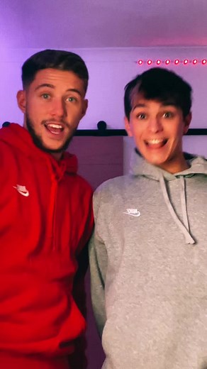 Playful Interaction Between Friends in Hoodies