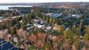 Cinematic 4K aerial drone dolly out shot of Medina, Hunts Point, Yarrow Point, Clyde Hill, Evergreen Pt floating bridge, Lake Washington mansions, luxury homes, villas