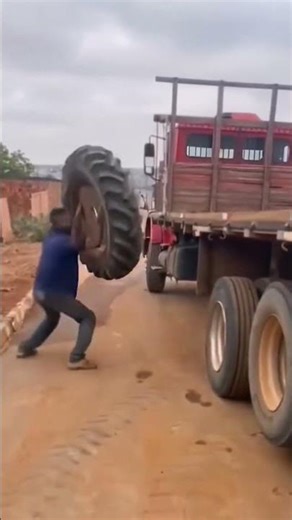 Clever loading process of a large tire onto a truck