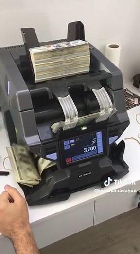 Money Counting Machine in Action: $20 Bills Processed