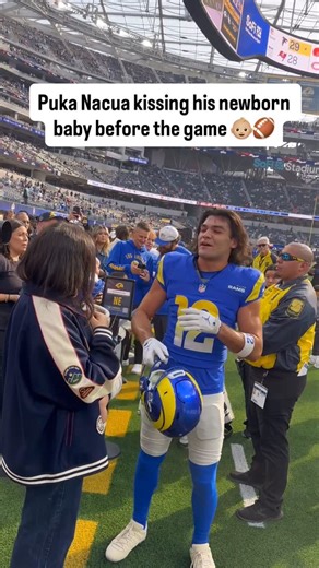 Gio Garcia️ on Instagram: "From dad mode to game mode 💙🏈 Puka Nacua sharing a pregame kiss with his newborn."