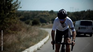 Sport Recreation Bike Cycling On Sunset Time. Cyclist In Helmet Riding On Sunset.Triathlon Time Trial Bicycle.Triathlete Training Endurance Cycling Race.Fit Cyclist Cardio Workout On Triathlon Bike