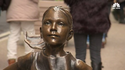 A statue of a young "Fearless Girl" that has been staring down New York City's iconic Wall Street bull since the eve of International Women's Day gets to keep her spot — at least for another year. Read full story: http://nbcnews.to/2orx3Oi | NBC News