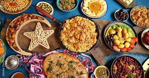 Traditional festive Muslim table. Middle Eastern foods. Popular dishes include kebabs, dolmas, falafel, baklava, yogurt, doner kebab, oliver, dates