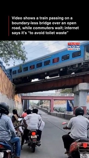 A viral video shows commuters stopping on a clear road under a railway bridge. The internet is assuming it’s to avoid poop — or more precisely, toilet waste from trains with open-pit systems. The clip has left many laughing, puzzled, and nodding at the very desi logic: India is not for beginners. [Train, Railway, Viral, Safety, Traffic] #NewsWithTN | TIMES NOW