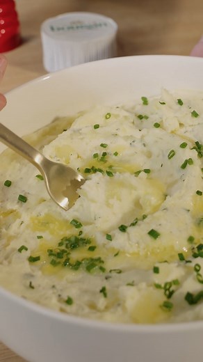 Let's be honest, Thanksgiving doesn't truly start until the Boursin Mashed Potatoes are ready. 😎 Ingredients: 1 box of Boursin Garlic & Fine Herbs Cheese 4 large Idaho potatoes, peeled and diced into 1/2” cubes 1/3 cup hot milk Ground white pepper Sea salt Chives (optional) Recipe: Put diced potatoes into medium saucepan and fill with cold water. Add large pinch of salt. Turn heat to high and bring to boil. Reduce to a simmer and cook until very tender, about 10 minutes. Drain, reserving 1/4 cu