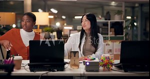 Advice, computer and web design with business women in office at night for project management. Collaboration, creative and discussion with website developer people in workplace for programming