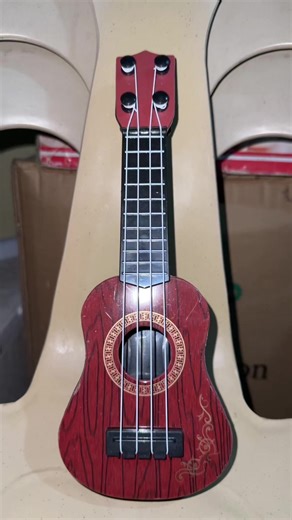 Explore the Mini 4 Strings Guitar