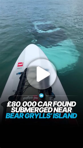 Casual paddle… unexpected Discovery 🚗👇🌊 A paddleboarder exploring the sea near an island owned by adventurer Bear Grylls made a surprising discovery when they spotted a luxury car resting on the seabed below. Footage shows the vehicle clearly visible underwater, sparking curiosity about how it ended up there. Authorities were alerted and investigations began to determine whether the car was lost accidentally, stolen, or deliberately dumped. The unusual find quickly drew attention online, with