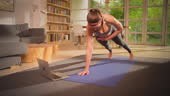 Young, athletic woman doing training with laptop. Working on...