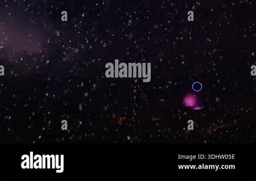Dramatic scene of a powerful winter thunderstorm at night. Illuminated by frequent cloud-to-ground lightning strikes, heavy snow falls intensely through the dark sky, creating a mesmerizing and severe weather phenomenon known as thundersnow Stock Video Footage - Alamy