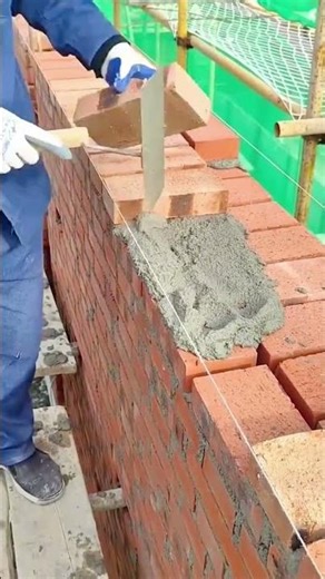A Skilled Bricklaying Process That Shows the Precision and Technique Behind Building a Strong Wall