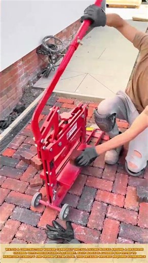 Skilled Worker Cutting Clay Pavers Using Manual Block Splitter for Precise Edge Fitting