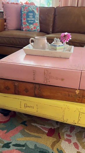1.5K views · 3.5K reactions | I redid this vintage coffee-table-that-looks-like-books and people keep telling me I “ruined” it.  But honestly… it was already rough. Gouges, ripped leather, dents—she’d lived a life. I repaired the leather, fixed the “pages,” and made it fit my home. And now? I’m obsessed… especially with the secret storage. So what do you think—ruined or redeemed? ✨ | At Home with Ashley | Facebook