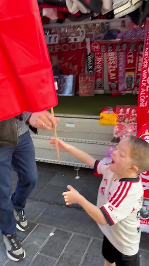 Isaac Kearney: A Proud Liverpool Fan's Delight with His Flag
