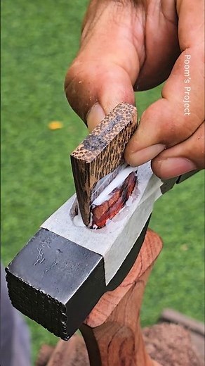 Installing the axe handle with black palm wood #woodworking