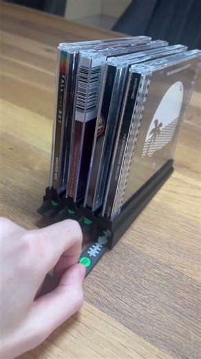 Discover our new 3D-printed CD holder with a hidden Spotify code underneath. #3dprinted #design