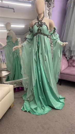 ✨ Luna Moth Gown ~ Sample Sale Highlight Tonight’s featured relic from the Firefly Path vault: the Luna Moth Gown, a hauntingly beautiful piece with a history written into every layer of liquid chiffon. 🦋🌙 https://www.ebay.com/itm/116893764244 This gown features: • Flowing mint liquid poly chiffon • Stretch satin underdress • Sleeves adorned with metal plastic chains and rhinestone details • Metal clasp halter neckline • Size Medium / Large She has been well loved in the studio ~ with tarnishe