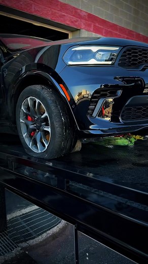“Supercharged accident delivery! The Hellcat Durango broken subframe & control arms 💥 touches down safe and sound in the garage. Another clean drop-off by TowVibes 🚨💨 #HellcatDurango #TowVibes #TowingLife #HookAndBook #StLouisTowing” | Tow Vibes