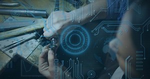 Animation of scope scanning and computer circuit board over caucasian man in workshop. global technology, connections and digital interface concept digitally generated video.