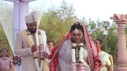 In this traditional Hindu wedding ceremony, the newly married couple...
