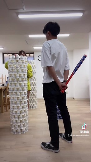Playful Cup Tower Chaos Between Friends