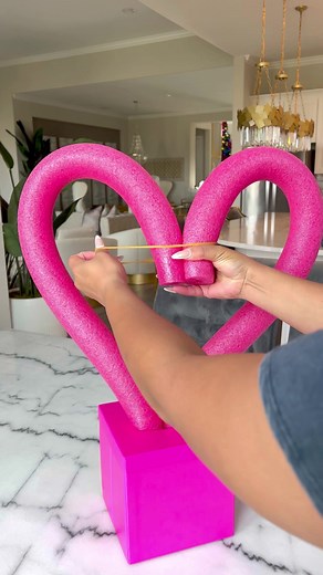 Cute DIY Valentine’s Centerpiece❤️ ⠀⠀⠀⠀ Pool Noodle/Pink Roses/Love Sign/Skewer Sticks/Bows: Dollar Tree. Use rubber bands and Skewers to anchor. So simple to make!!! #diy #diyproject #dollartree #dollartreefinds #diyhomedecor #valentinesday