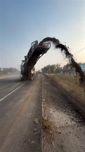CONSTRUCTION WORLD on Instagram: "A bitumen road scarifier is a heavy-duty construction machine with rotating teeth or cutters that shaves, loosens, and removes layers of old asphalt or bitumen from roads for rehabilitation, resurfacing, or leveling, preparing the surface for new material by creating an ideal profile for bonding and preventing potholes. These machines come in various sizes, from large, grader-mounted units to smaller, walk-behind models, using carbide cutters for precision and e