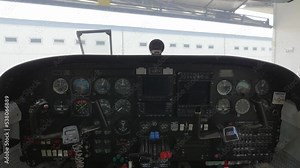 Classic Instrument Panel of Aircraft Inside Hangar with Closing Doors.