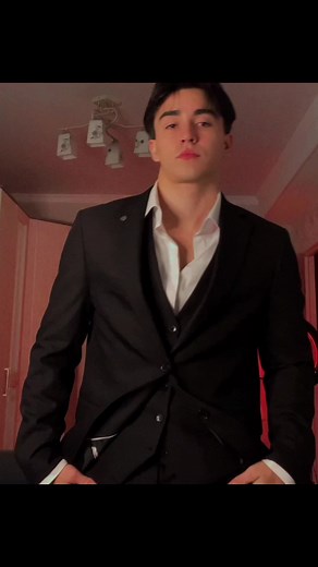 Stylish Man in Suit Dancing to Popular Music