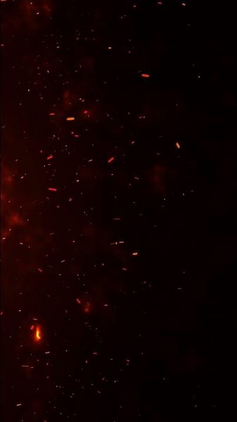 4k fire embers fire Particles sparks over black background, Fire flames particles swirls in the air.