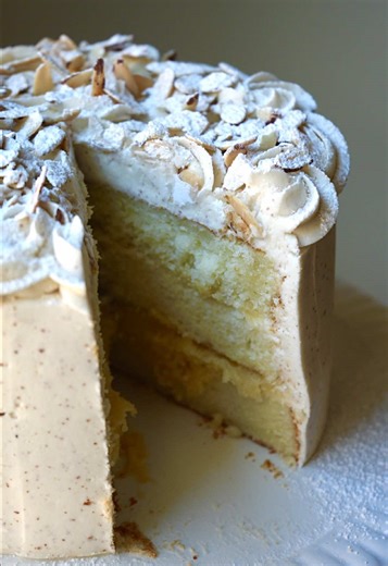 Almond Croissant Cake This almond vanilla layer cake is filled with cooked frangipane, frosted in brown butter buttercream, and finished with piped rosettes, toasted almonds, and a dusting of powdered sugar. If you love almond croissants, this cake version is absolutely delicious and perfect for special occasions or weekend baking. Recipe below👇🏻 Almond Vanilla Cake Ingredients \t•\t1 cup (226 g) unsalted butter, softened \t•\t¾ cup (165 ml) neutral oil (avocado) \t•\t2½ cups (500 g) granulate