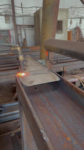 Metalworking Process: Welding Rusty Beams in Industry