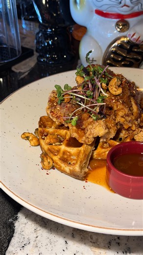 Studio East Asian Gastropub on Instagram: "Come try our new upgraded FRiED CHiCKEN & WAFFLES this weekend for brunch only! 🧇 House karaage chicken, pumpkin spiced waffles, pumpkin marmalade, praline, house kimchi relish, sriracha maple syrup! These aren’t your typical chicken and waffles, they got big bold sweet and savoury flavours with a bit of a spice kick! This will bring you straight to food heaven 😇 Available Saturday & Sundays (11am-2pm)! Bring your friends and appetites!"