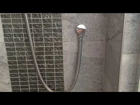 Fitting a water saving restrictor to a shower