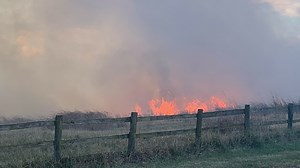'Fire moving fast': Forest firefighters respond to tractor, dozens of hay bales on fire
