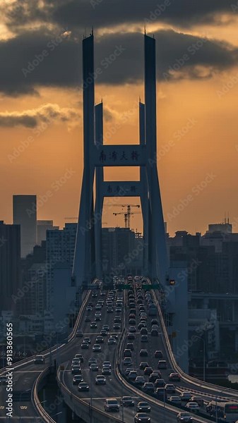 The traffic flow on the Nanpu Bridge and elevated roads in Shanghai at sunset